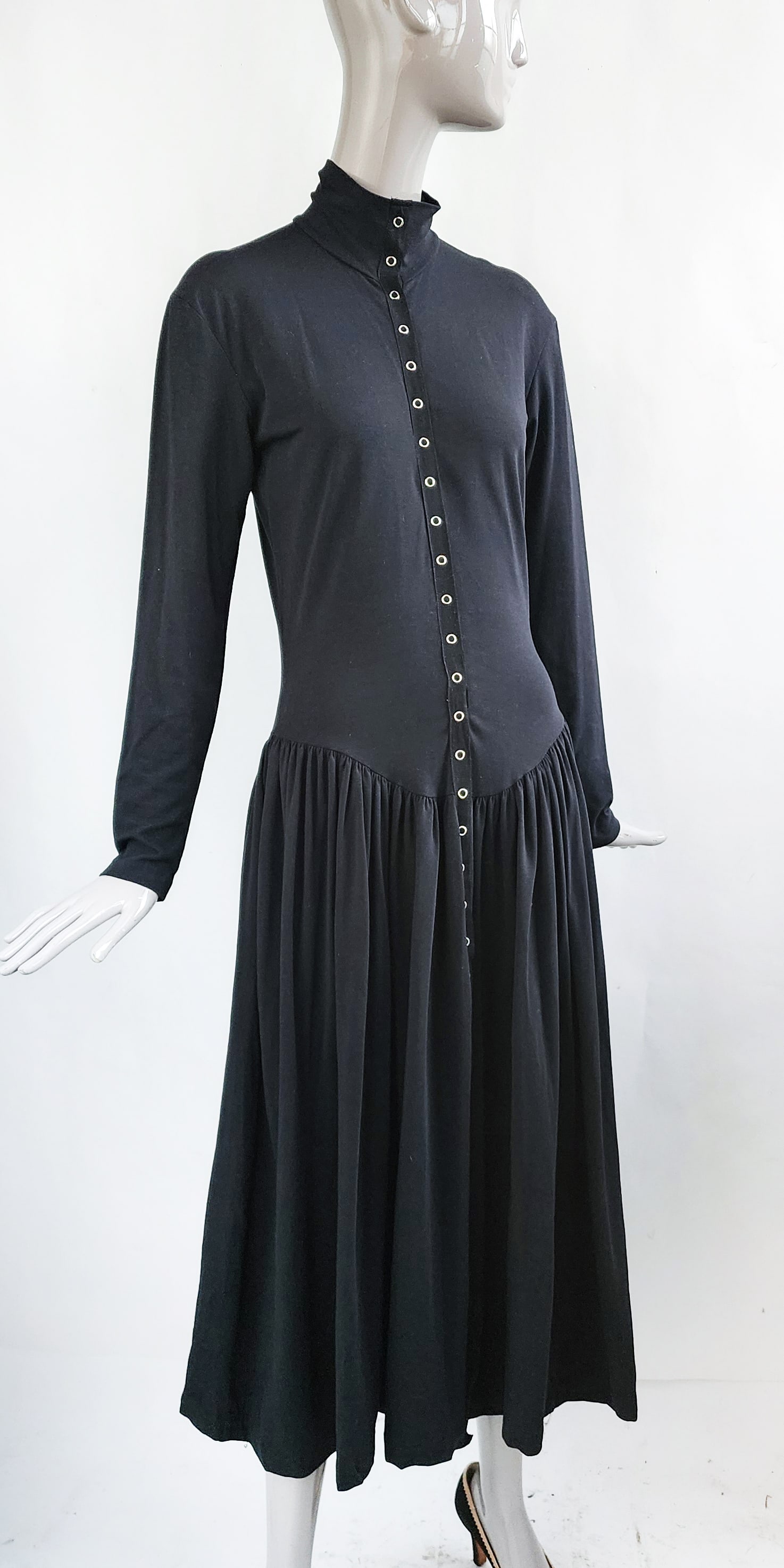 Early Betsey Johnson Black Jersey Snap Front Dress, 1980s: Early Betsey Johnson black cotton & Lycra jersey snap front dress, ca. early to mid 1980s. Made in USA, size label L. Provenance: Estate of Victoria Salter (1944-2024) Victoria Salter was the daughter