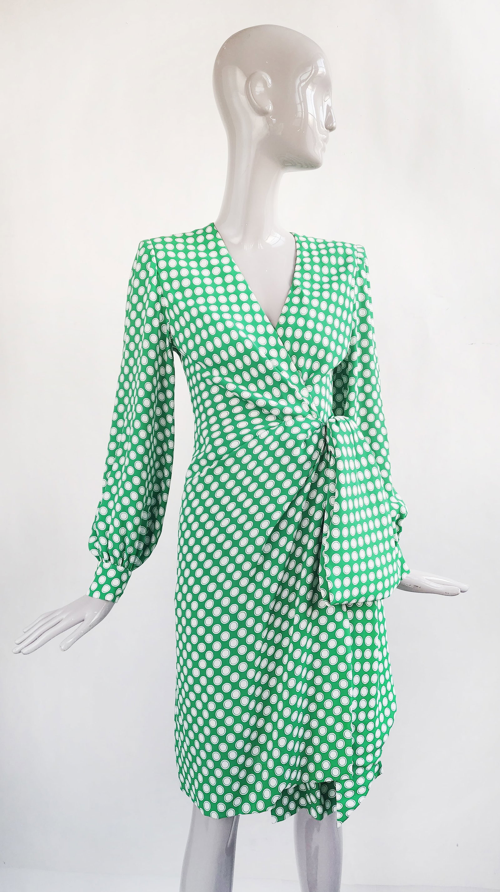 Givenchy Nouvelle Boutique Green Polka Dot Wrap Dress, c. 1987: Givenchy Nouvelle Boutique green & white polka dot print rayon crepe wrap dress, circa 1987-1988. Made in France. Skirt lined in silk. No size tag. Waist circumference 24 inches.