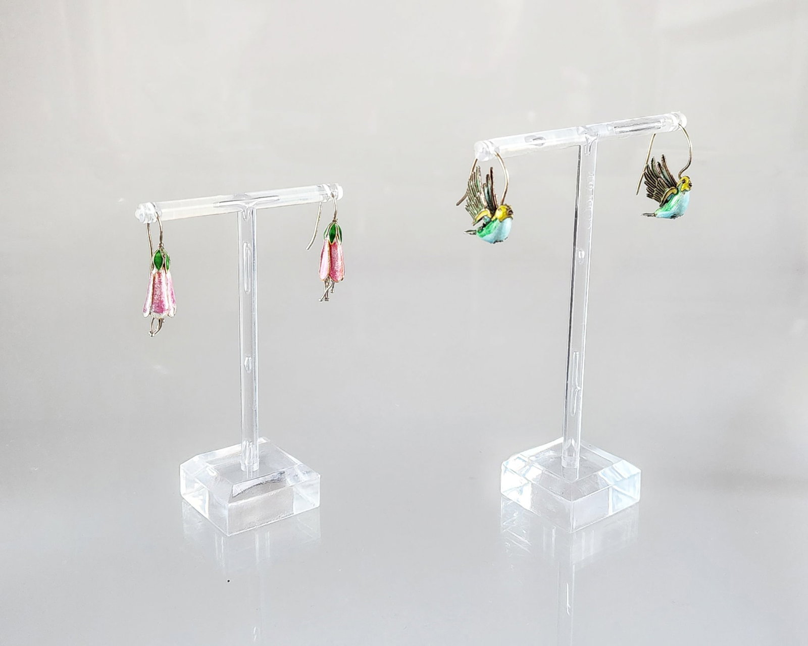 Estate Antique Chinese Enamelled Silver Flower & Hummingbird Earrings: Estate Antique Chinese Enamelled Silver Flower & Hummingbird Two Pairs of Earrings Marks: Total weight: 8.6 grams. Provenance: Estate of Victoria Salter (1944-2024) Victoria Salter was the daughter of