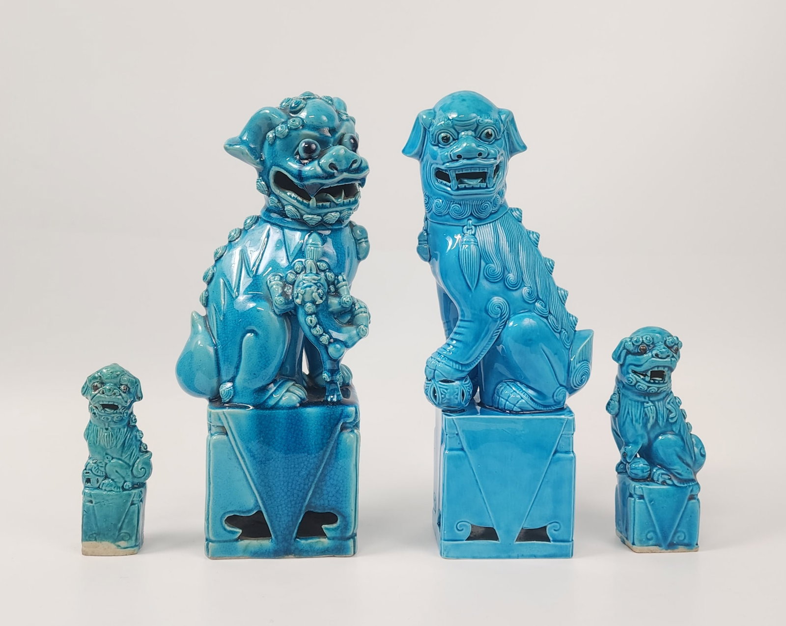 Lot of 4 Chinese Turquoise Blue Glazed Foo Dogs: Lot of 4 Chinese Turquoise Blue Glazed Foo Dogs, largest h. 12 inches, smallest h. 5 inches, circa early to mid 20th century. Provenance: Estate of a New York collector/ dealer. The collection assembl