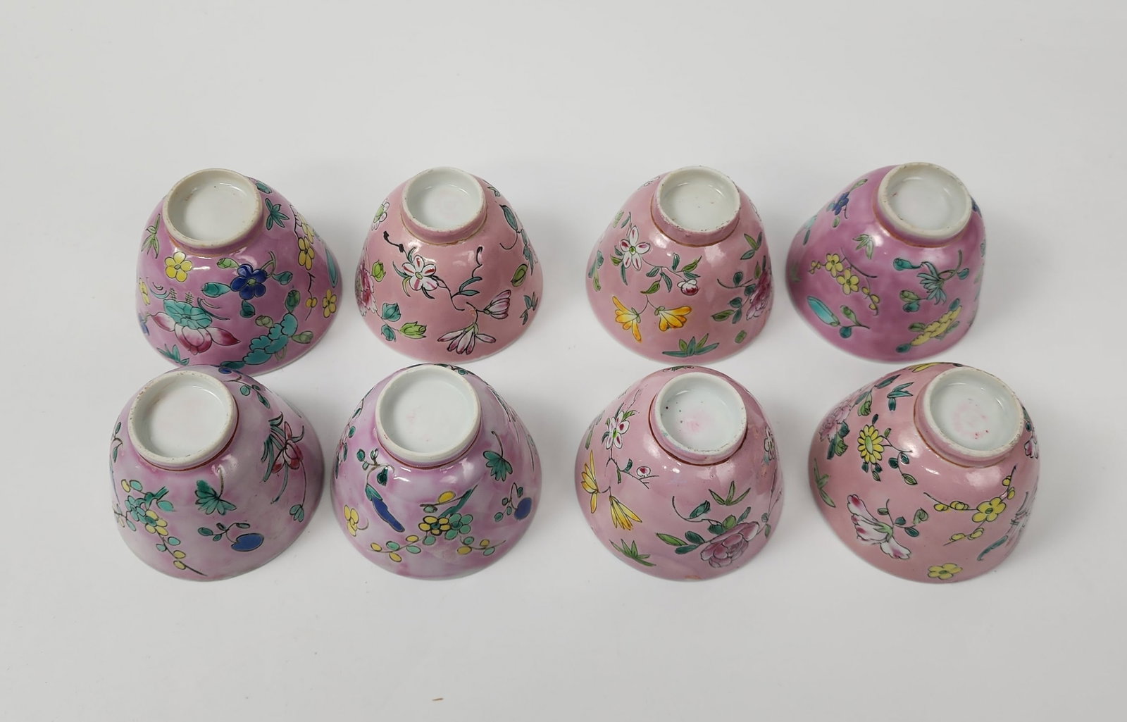 Lot of Chinese Famile Rose Pink Ground Porcelain Cups: Lot of Chinese Famile Rose Pink Ground Porcelain Cups With Turquoise blue enameled interiors, h. 2 inches, circa 20th century. Provenance: Estate of a New York collector/ dealer. The collection assemb