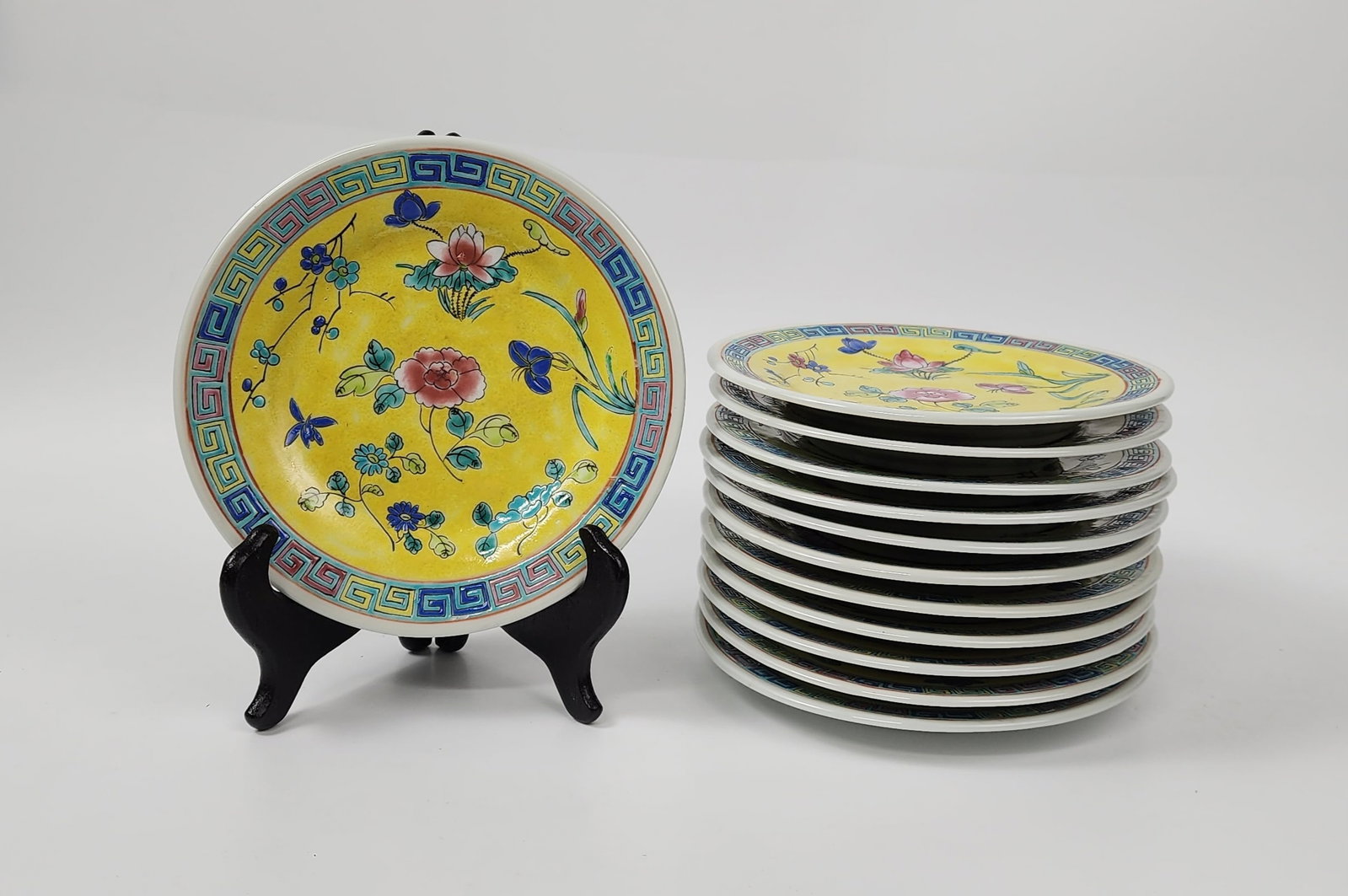 Set of 12 Antique Chinese Export Famille Rose Yellow Ground Enameled Plates: Set of 12 Antique Chinese Export Famille Rose Yellow Ground Enameled Plates, d. 7 inches, marked China in iron red at the bottom, circa early 20th century. Provenance: Estate of a New York collector/ 