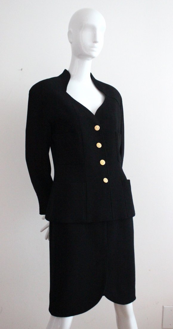 Chanel Boutique Black Skirt Suit, c.1980's: Chanel Boutique by Karl Lagerfeld Black Wool Skirt Suit with Gold Tone Clove Buttons, c.1980's.