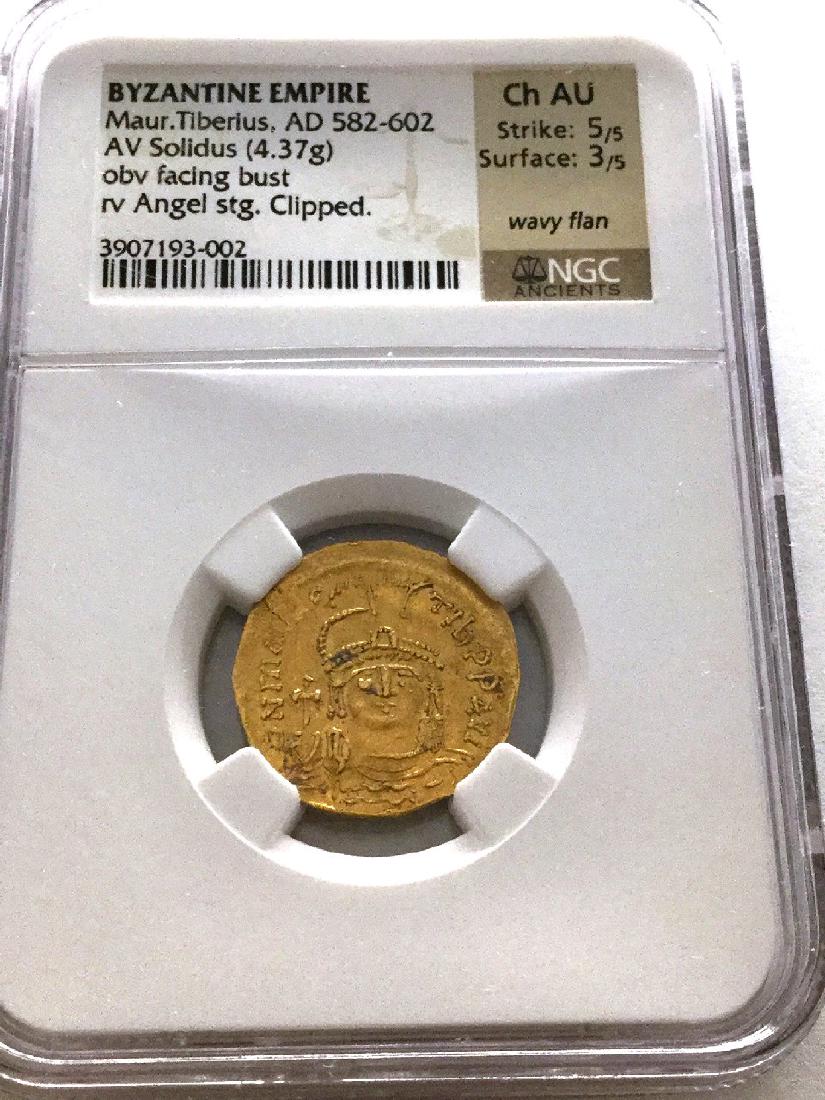 *Byzantine Empire Maur.Tiberius. AD 582-602 AV NGC CH: Gov. File: C-52708 *Byzantine Empire Maur.Tiberius. AD 582-602 AV NGC CH AU Extremely Rare Coin (JG hkk) Asset Type: Coin Shipping: $9.95