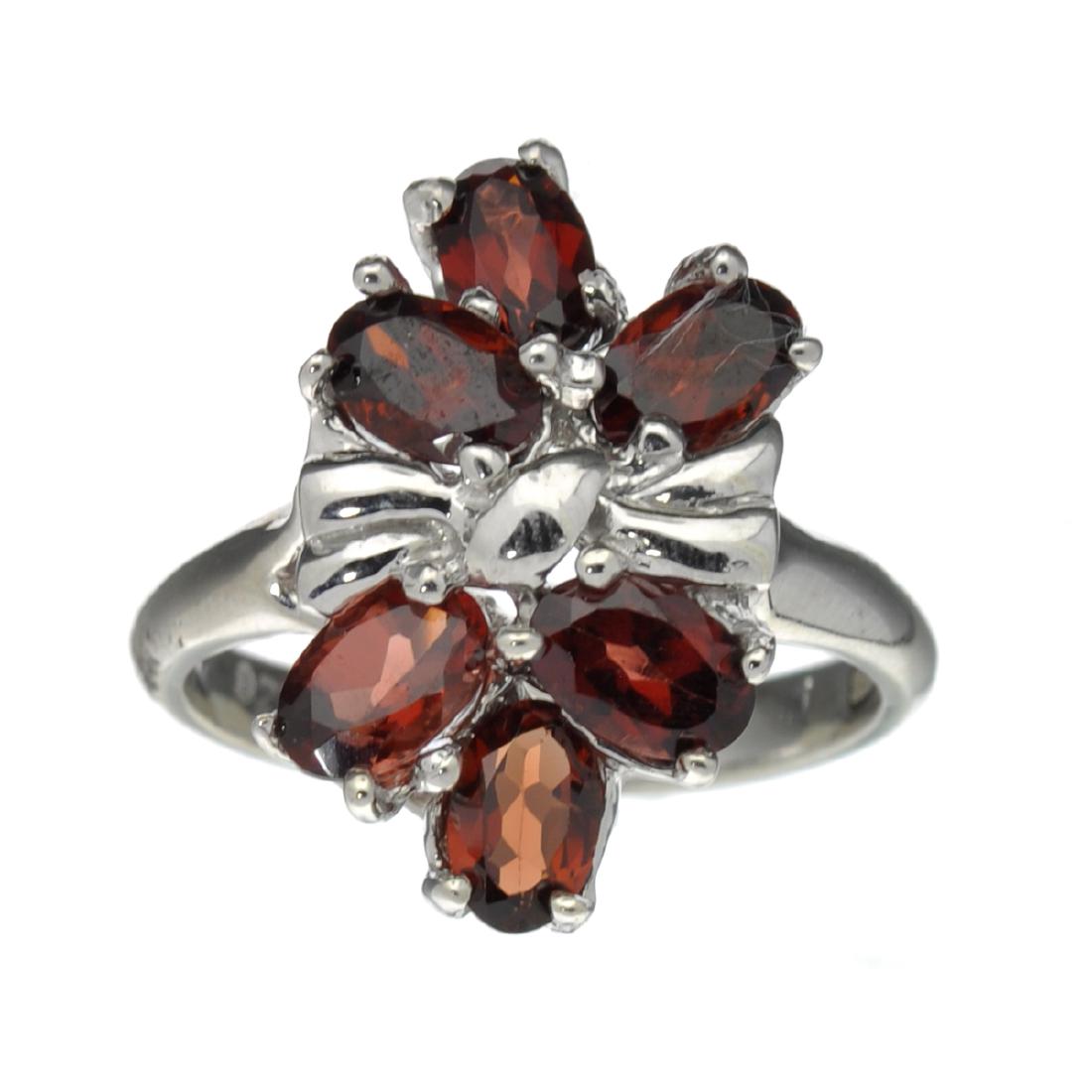 Fine Jewelry Designer Sebastian 3.28CT Oval Cut: Gov. File: H-30883 Fine Jewelry Designer Sebastian, 3.28CT Oval Cut Almandite Garnet And Sterling Silver Cluster Ring Retail Replacement Value: $0.5K Asset Type: Ring Shipping: $19.95