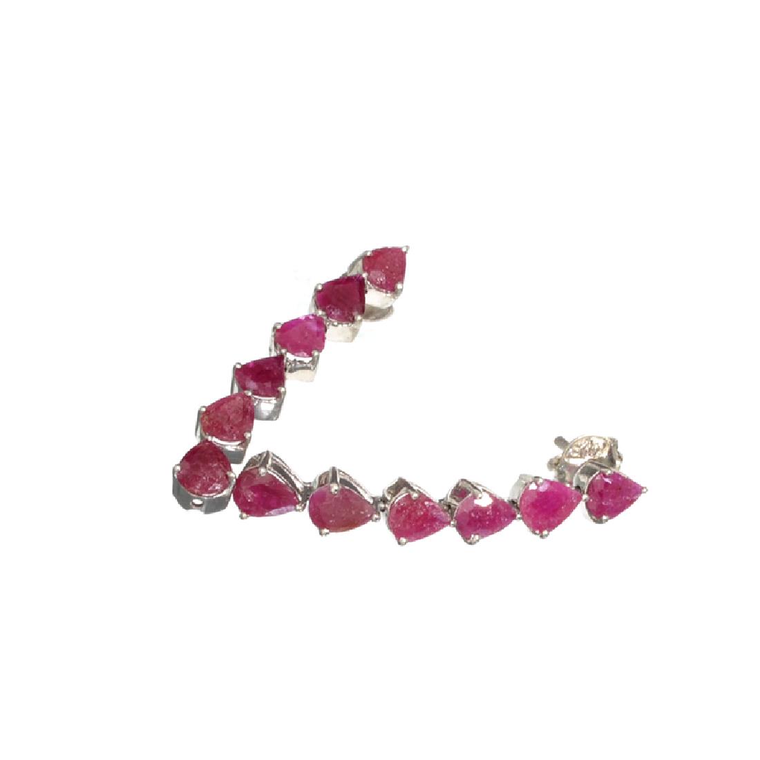 APP: 1k Fine Jewelry 5.14CT Pear Cut Ruby And Sterling: Gov. File: H-20905 Fine Jewelry 5.14CT Pear Cut Ruby And Sterling Silver Dangle Earrings Retail Replacement Value: $1.0K Asset Type: Earrings Shipping: $19.95