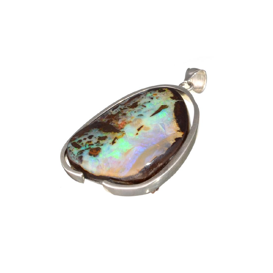 APP: 6.2k Fine Jewelry 19.00CT Freeform Boulder Opal: Gov. File: H-10047 Fine Jewelry 19.00CT Freeform Boulder Opal And Sterling Silver Pendant Retail Replacement Value: $6.2K Asset Type: Pendant Shipping: $19.95