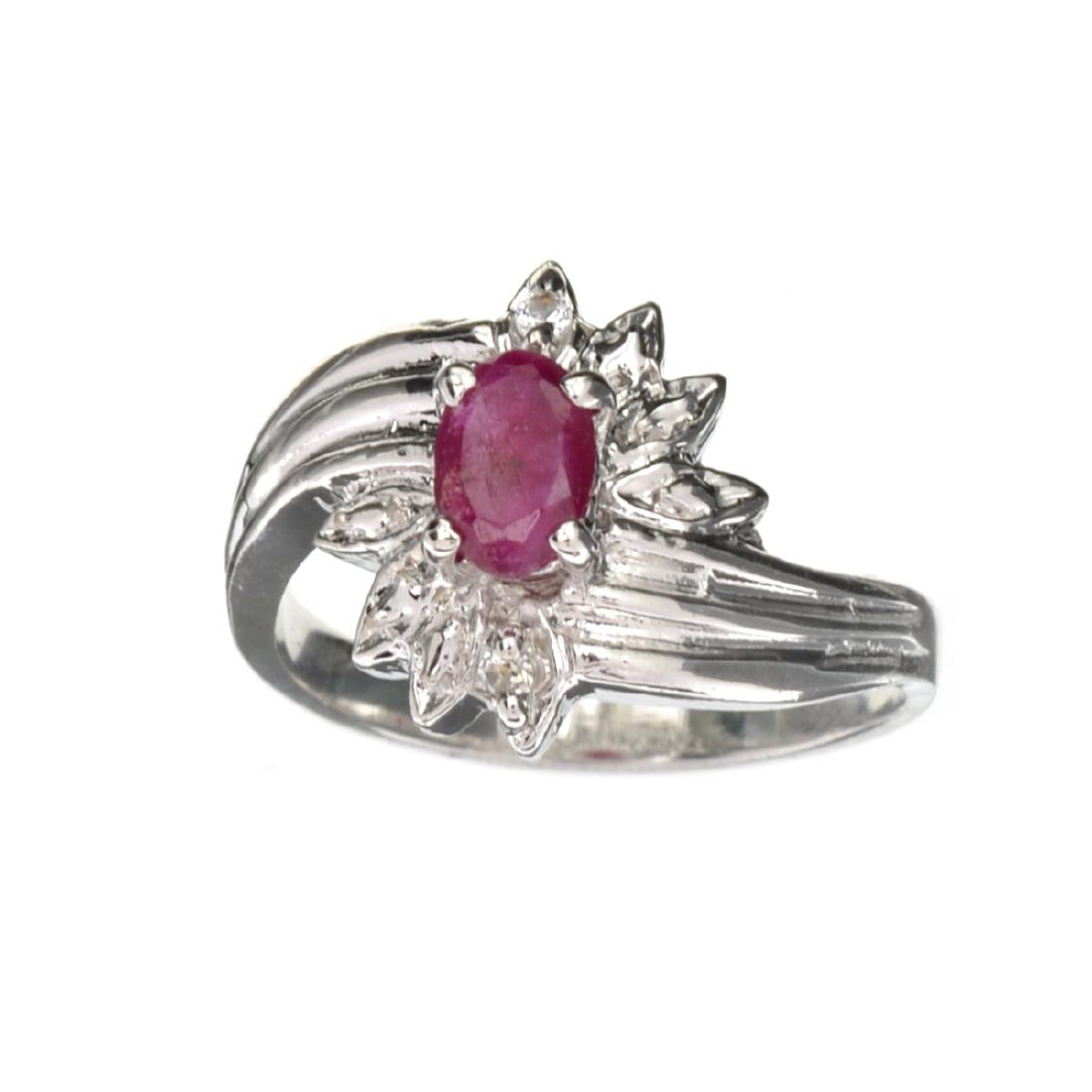 APP: 0.8k 0.60CT Ruby And Topaz Platinum Over Sterling: Gov. File: 94771 0.60CT Ruby And Topaz Platinum Over Sterling Silver Ring Retail Replacement Value: $0.8K Asset Type: Ring Shipping: $19.95