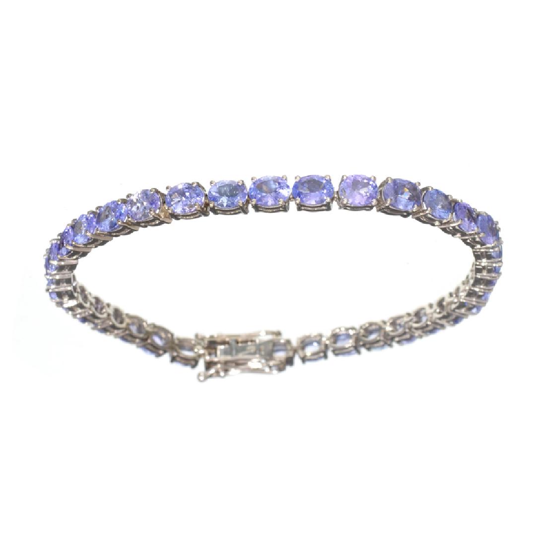 APP: 6.4k Fine Jewelry 12.50CT Oval Cut Tanzanite And: Gov. File: H-20547 Fine Jewelry 12.50CT Oval Cut Tanzanite And Sterling Silver Tennis Bracelet Retail Replacement Value: $6.4K Asset Type: Bracelet Shipping: $19.95