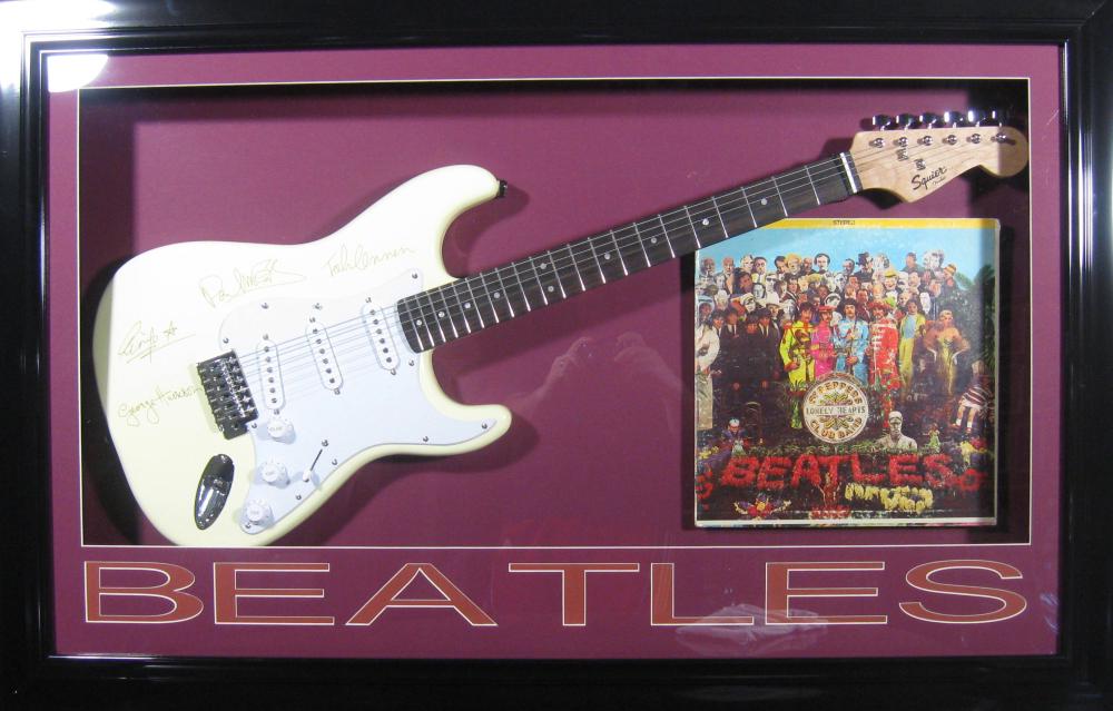 *Rare The Beatles Sergeant Pepper Album with Guitar: Gov. File: M-19163 *Rare The Beatles Sergeant Pepper Album with Guitar Museum Framed Collage - Plate Signed Asset Type: CollectableShipping: $39.95. Item may be pick up only, or require additional shi