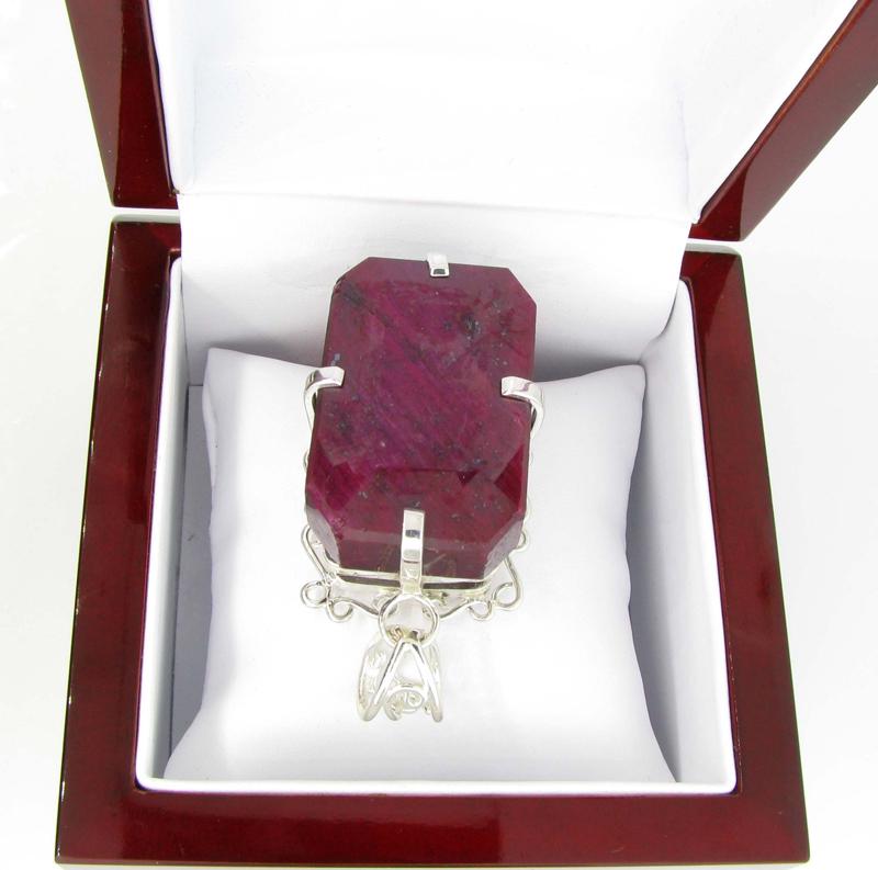 APP: 14.5k Designer Sebastian 341.76CT Emerald Cut Ruby: Gov. File: K-01667 Designer Sebastian 341.76CT Emerald Cut Ruby and Sterling Silver Pendant Retail Replacement Value:$14.4K Pendant Shipping: $19.95