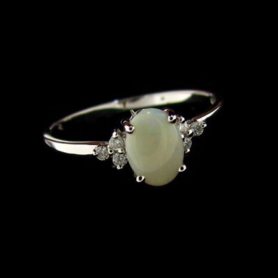 18 kt. White Gold, 0.52CT Opal & Diamond Ring: 18 kt. White Gold, 0.52CT Opal and Diamond Ring - Thank you for viewing this Item. We hope that you are successful in your bidding. For over 30 years we have given the best possible customer service t