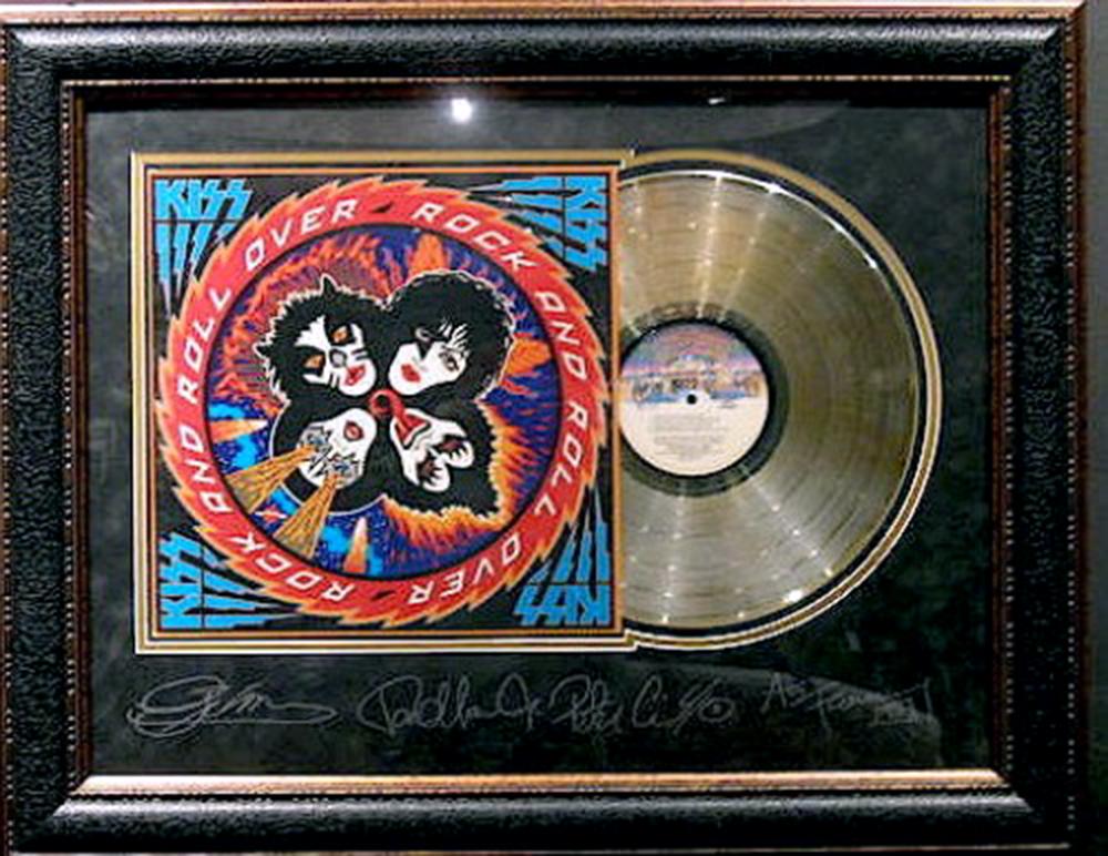 *Rare KISS Rock and Roll Over Album Cover and Gold: Gov. File: M-20224 *Rare KISS Rock and Roll Over Album Cover and Gold Record Museum Framed Collage - Plate Signed Asset Type: CollectableShipping: $39.95. Item may be pick up only, or require addition