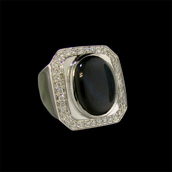 APP: 12k 14 kt. White Gold, 14.35CT Blue Star Sapphire : 14 kt. White Gold, 14.35CT Blue Star Sapphire and Diamond Ring signed M. Christoff - Appraisal Value: $11.9K - Bid with utmost confidence from GovernmentAuction.com. We have been in business for over 