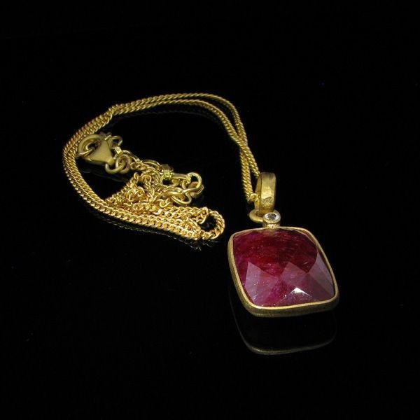 APP: 22k 26CT 24kt Gold overlay Ruby Pendant with chain: 26.50CT 24 kt. Gold overlay, Ruby Pendant with chain - Appraisal Value: $22.8K - Bid with utmost confidence from GovernmentAuction.com. We have been in business for over 35 years, and pride ourselves