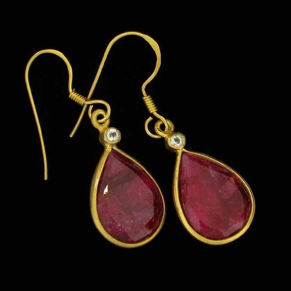 APP: 10k 24kt Gold 19CT Ruby & Sterling Silver Earring: 24 kt. Gold Overlay, 19.87CT Ruby, And Sterling Silver Earrings - Appraisal Value: $10.1K - Bid with utmost confidence from GovernmentAuction.com. We have been in business for over 35 years, and pride