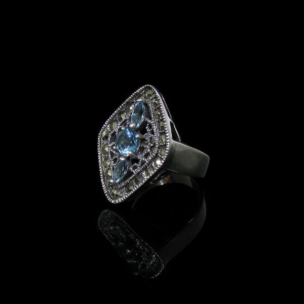 Blue Topaz, Marcasite & Sterling Silver Ring: Blue Topaz, Marcasite and Sterling Silver Ring - Bid with utmost confidence from GovernmentAuction.com. We have been in business for over 35 years, and pride ourselves on perfect customer service.
