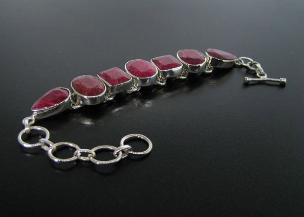 APP: 15.2k 53.88CT Ruby & Sterling Silver Bracelet: 53.88CT Ruby and Sterling Silver Bracelet - Appraisal Value: $15.1K - Bid with utmost confidence from GovernmentAuction.com. We have been in business for over 35 years, and pride ourselves on perfect 