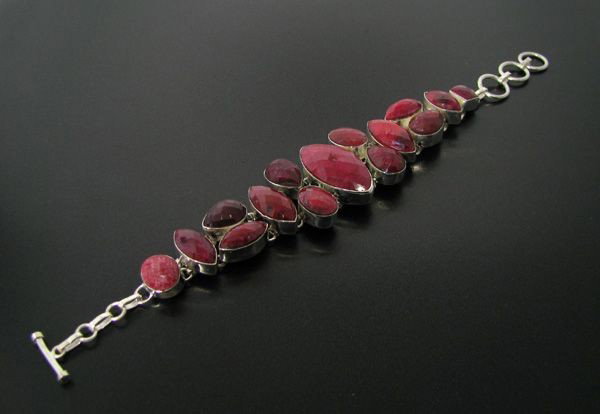 APP: 66.8k 128.07CT Ruby & Sterling Silver Bracelet: 128.07CT Ruby and Sterling Silver Bracelet - Appraisal Value: $66.7K - Bid with utmost confidence from GovernmentAuction.com. We have been in business for over 35 years, and pride ourselves on perfect