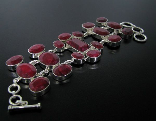APP: 64.5k 122.53CT Ruby & Sterling Silver Bracelet: 122.53CT Ruby and Sterling Silver Bracelet - Appraisal Value: $64.4K - Bid with utmost confidence from GovernmentAuction.com. We have been in business for over 35 years, and pride ourselves on perfect