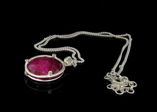 APP: 18k 28.69CT Ruby & Sterling Silver Pendant w/chain: 28.69CT Ruby and Sterling Silver Pendant with chain - Appraisal Value: $18.2K - Bid with utmost confidence from GovernmentAuction.com. We have been in business for over 35 years, and pride ourselves o