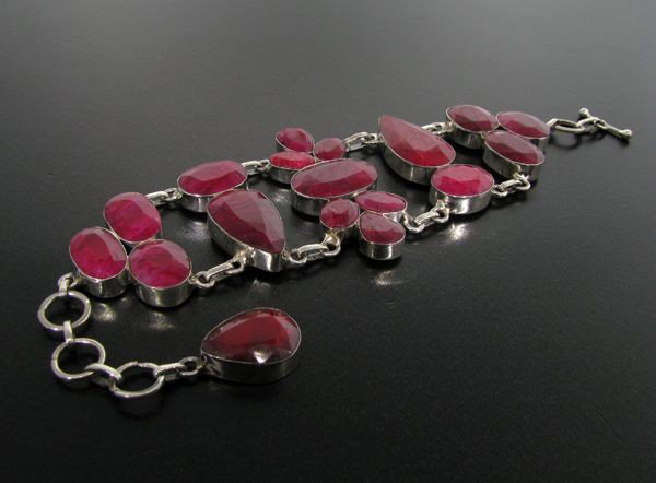 APP: 27.7k 142.10CT Ruby & Sterling Silver Bracelet: 142.10CT Ruby and Sterling Silver Bracelet - Appraisal Value: $27.7K - Bid with utmost confidence from GovernmentAuction.com. We have been in business for over 35 years, and pride ourselves on perfect