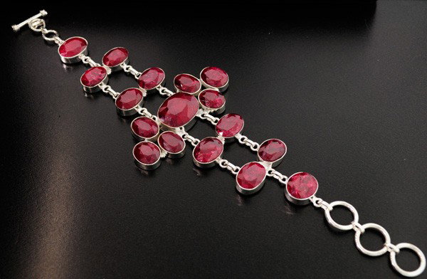APP: 21k 123.56CT Ruby & Sterling Silver Bracelet: 123.56CT Ruby and Sterling Silver Bracelet - Appraisal Value: $21.0K - Bid with utmost confidence from GovernmentAuction.com. We have been in business for over 35 years, and pride ourselves on perfect