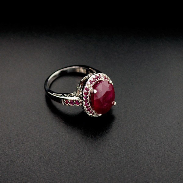 APP: 11k 9CT Ruby Platinum Overlay Sterling Silver Ring: 9.35CT Ruby Platinum Overlay Sterling Silver Ring - Appraisal Value: $10.9K - Bid with utmost confidence from GovernmentAuction.com. We have been in business for over 35 years, and pride ourselves on 