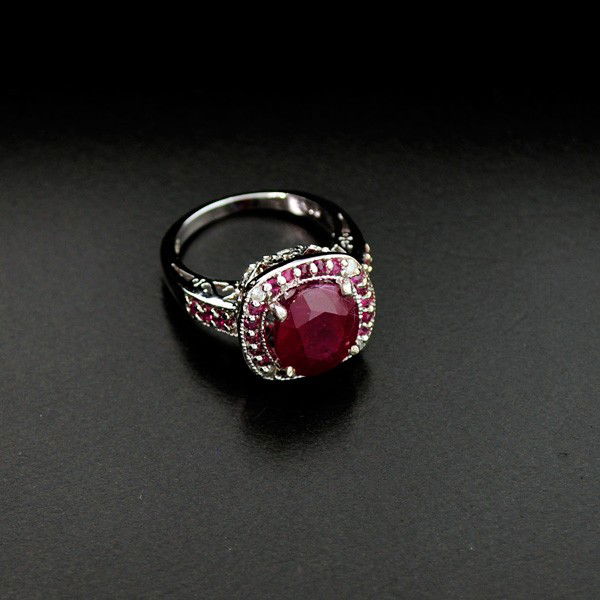APP: 10k 6CT Ruby Platinum Overlay Sterling Silver Ring: 6.20CT Ruby Platinum Overlay Sterling Silver Ring - Appraisal Value: $10.7K - Bid with utmost confidence from GovernmentAuction.com. We have been in business for over 35 years, and pride ourselves on