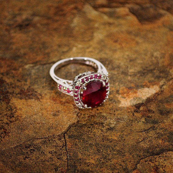 APP: 11k 5CT Ruby Platinum Overlay Sterling Silver Ring: 5.96CT Ruby Platinum Overlay Sterling Silver Ring - Appraisal Value: $10.9K - Bid with utmost confidence from GovernmentAuction.com. We have been in business for over 35 years, and pride ourselves on 