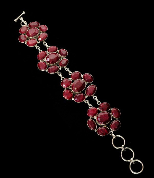 APP: 25k 144.76CT Ruby & Sterling Silver Bracelet: 144.76CT Ruby and Sterling Silver Bracelet - Appraisal Value: $24.9K - Bid with utmost confidence from GovernmentAuction.com. We have been in business for over 35 years, and pride ourselves on perfect