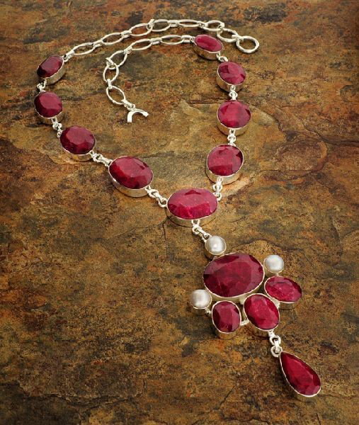 APP: 30k 213CTRuby w/Pearls & Sterling Silver Necklace: 213.33CT Ruby W/ Pearls ans Sterling Silver Necklace - Appraisal Value: $30.1K - Bid with utmost confidence from GovernmentAuction.com. We have been in business for over 35 years, and pride ourselves 