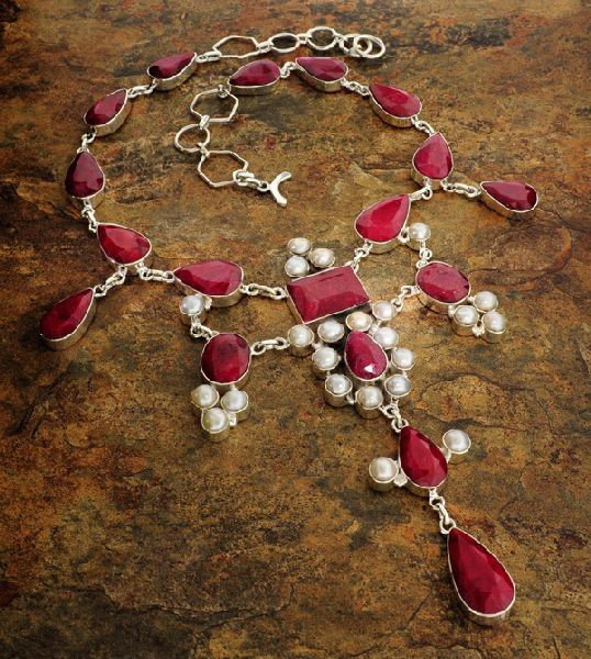 APP: 29k 194CTRuby w/Pearls & Sterling Silver Necklace: 194.05CT Ruby W/ Pearls ans Sterling Silver Necklace - Appraisal Value: $29.3K - Bid with utmost confidence from GovernmentAuction.com. We have been in business for over 35 years, and pride ourselves 
