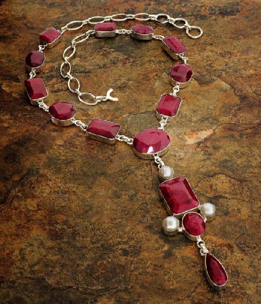 APP: 27k 192CTRuby w/Pearls & Sterling Silver Necklace: 192.39CT Ruby W/ Pearls ans Sterling Silver Necklace - Appraisal Value: $27.7K - Bid with utmost confidence from GovernmentAuction.com. We have been in business for over 35 years, and pride ourselves 
