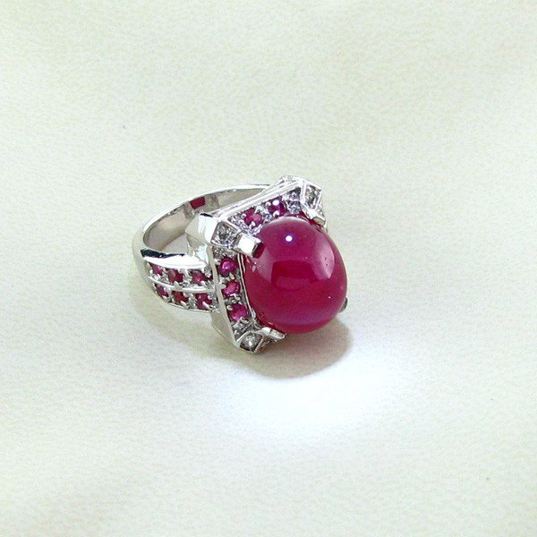 APP: 16k 13CT Ruby & Platinum Sterling Silver Ring: 13.90CT Ruby and Platinum Overlay Sterling Silver Ring - Appraisal Value: $16.5K - Bid with utmost confidence from GovernmentAuction.com. We have been in business for over 35 years, and pride ourselve