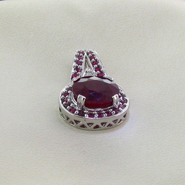 APP: 11k 10CT Ruby & Platinum Sterling Silver Pendant: 10.76CT Ruby and Platinum Overlay Sterling Silver Pendant - Appraisal Value: $11.3K - Bid with utmost confidence from GovernmentAuction.com. We have been in business for over 35 years, and pride ourse
