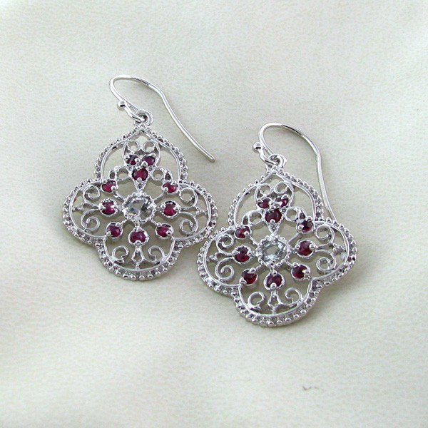 APP: 1k 1CT Ruby w/Colorless Topaz & Silver Earrings: 1.59CT Ruby W/ Colorless Topaz and Platinum Overlay Sterling Silver Earrings - Appraisal Value: $1.7K - Bid with utmost confidence from GovernmentAuction.com. We have been in business for over 35 year