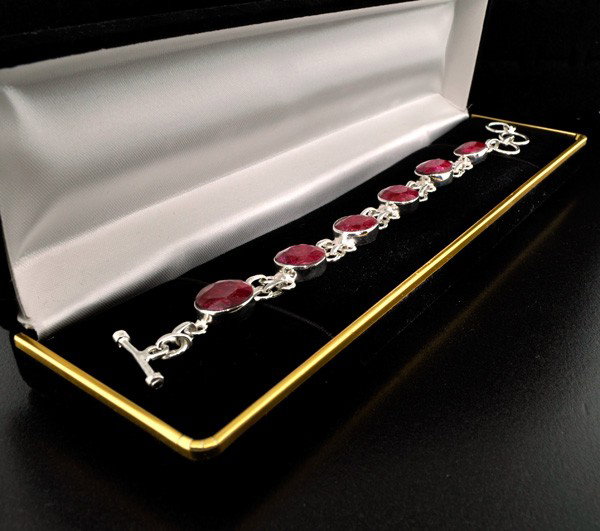 APP: 10.5k 26.53CT Ruby & Sterling Silver Bracelet: 26.53CT Ruby and Sterling Silver Bracelet - Appraisal Value: $10.5K - Bid with utmost confidence from GovernmentAuction.com. We have been in business for over 35 years, and pride ourselves on perfect 