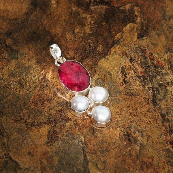 APP: 7k 14.80CT Ruby w/Pearls & Sterling Silver Pendant: 14.80CT Ruby With Pearls and Sterling Silver Pendan - Appraisal Value: $7.3K - Bid with utmost confidence from GovernmentAuction.com. We have been in business for over 35 years, and pride ourselves on
