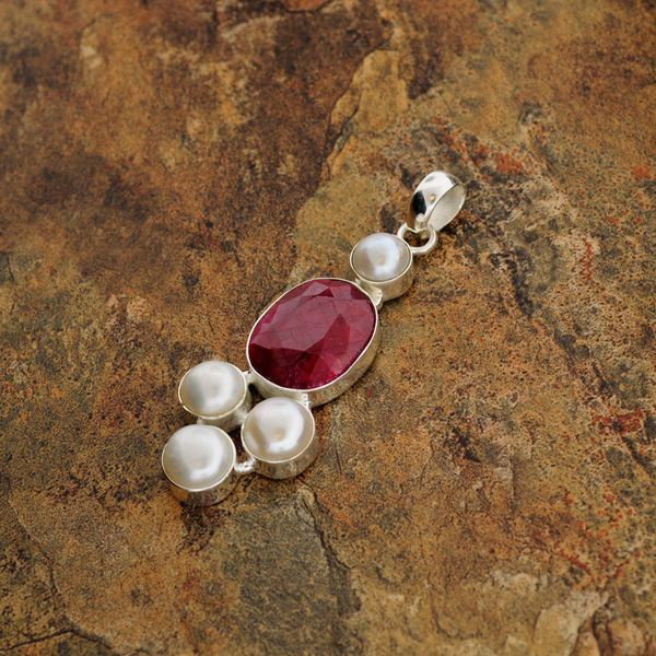 APP: 11k 19CTRuby w/Pearls & Sterling Silver Pendant: 19.05CT Ruby With Pearls and Sterling Silver Pendan - Appraisal Value: $11.4K - Bid with utmost confidence from GovernmentAuction.com. We have been in business for over 35 years, and pride ourselves o