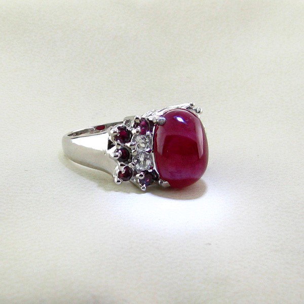 APP: 14k 12CT Ruby & Platinum Sterling Silver Ring: 12.19CT Ruby and Platinum Overlay Sterling Silver Ring - Appraisal Value: $14.5K - Bid with utmost confidence from GovernmentAuction.com. We have been in business for over 35 years, and pride ourselve