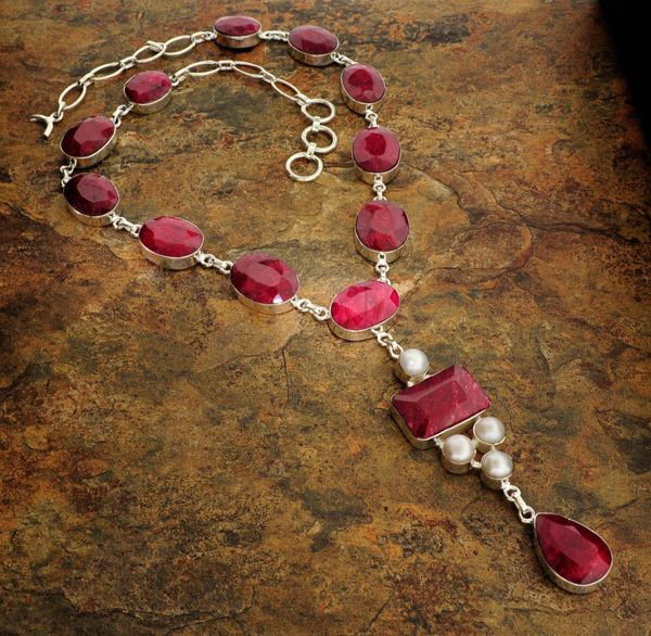 APP: 24k 167CTRuby w/Pearls & Sterling Silver Necklace: 167.91CT Ruby W/ Pearls ans Sterling Silver Necklace - Appraisal Value: $24.9K - Bid with utmost confidence from GovernmentAuction.com. We have been in business for over 35 years, and pride ourselves 
