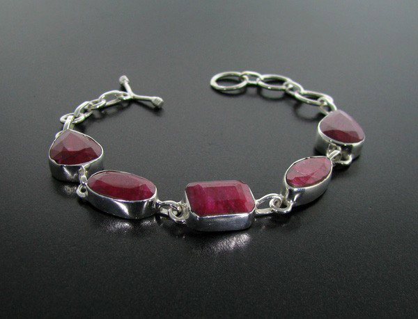 APP: 12.2k 31.21CT Ruby & Sterling Silver Bracelet: 31.21CT Ruby and Sterling Silver Bracelet - Appraisal Value: $12.1K - Bid with utmost confidence from GovernmentAuction.com. We have been in business for over 35 years, and pride ourselves on perfect 