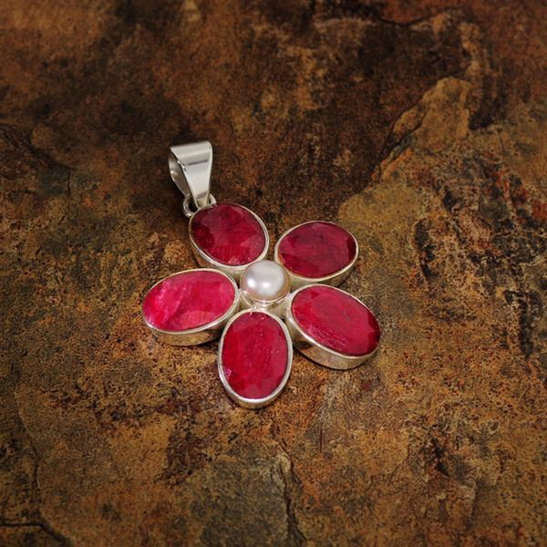 APP: 12k 30CTRuby w/Pearls & Sterling Silver Pendant: 30.70CT Ruby With Pearls and Sterling Silver Pendan - Appraisal Value: $12.6K - Bid with utmost confidence from GovernmentAuction.com. We have been in business for over 35 years, and pride ourselves o