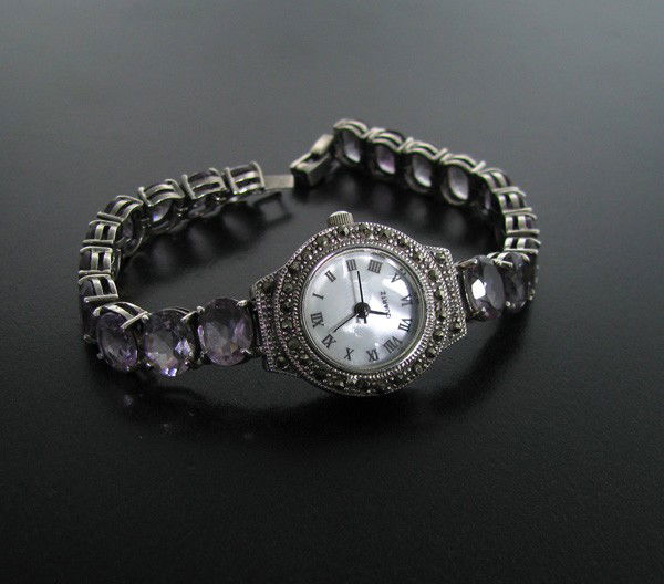 Amethyst & Sterling Silver Watch: Amethyst and Sterling Silver Watch - Bid with utmost confidence from GovernmentAuction.com. We have been in business for over 35 years, and pride ourselves on perfect customer service.