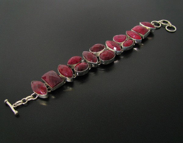 APP: 6.8k 128.32CT Ruby & Sterling Silver Bracelet: 128.32CT Ruby and Sterling Silver Bracelet - Appraisal Value: $6.7K - Bid with utmost confidence from GovernmentAuction.com. We have been in business for over 35 years, and pride ourselves on perfect 