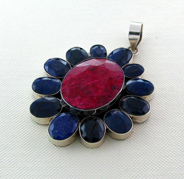 APP: 13k 96CT Ruby w/Sapphire & Sterl Silver Pendant: 96.43CT Ruby W/ Blue Sapphire and Sterling Silver Pendant - Appraisal Value: $13.4K - Bid with utmost confidence from GovernmentAuction.com. We have been in business for over 35 years, and pride ourse