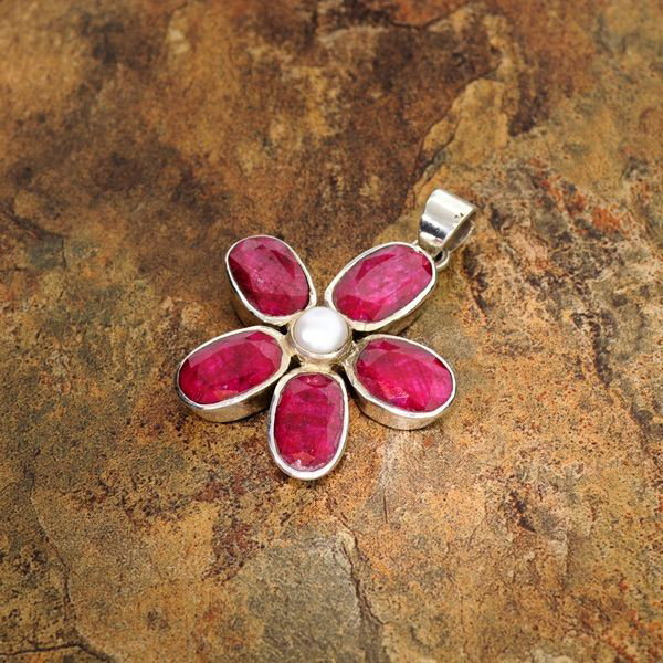 APP: 5.6k 20.64CT Ruby & Sterling Silver Pendant: 20.64CT Ruby and Sterling Silver Pendant - Appraisal Value: $5.6K - Bid with utmost confidence from GovernmentAuction.com. We have been in business for over 35 years, and pride ourselves on perfect cu