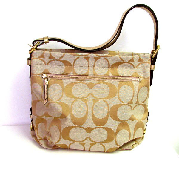 Coach Handcrafted Khaki w/Gold/Pink Interior Handbag: Coach- Original Handcrafted Light Khaki W/ Gold & Pink Interior - Handbag - Bid with utmost confidence from GovernmentAuction.com. We have been in business for over 35 years, and pride ourselves on pe