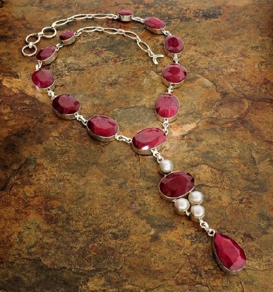 APP: 20k 137CTRuby w/Pearls & Sterling Silver Necklace: 137.52CT Ruby W/ Pearls ans Sterling Silver Necklace - Appraisal Value: $20.9K - Bid with utmost confidence from GovernmentAuction.com. We have been in business for over 35 years, and pride ourselves 
